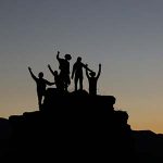 5 people on the top of a mountain